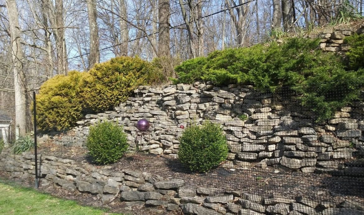 Conquering Hills and Valleys Fencing Solutions for Sloped Yards